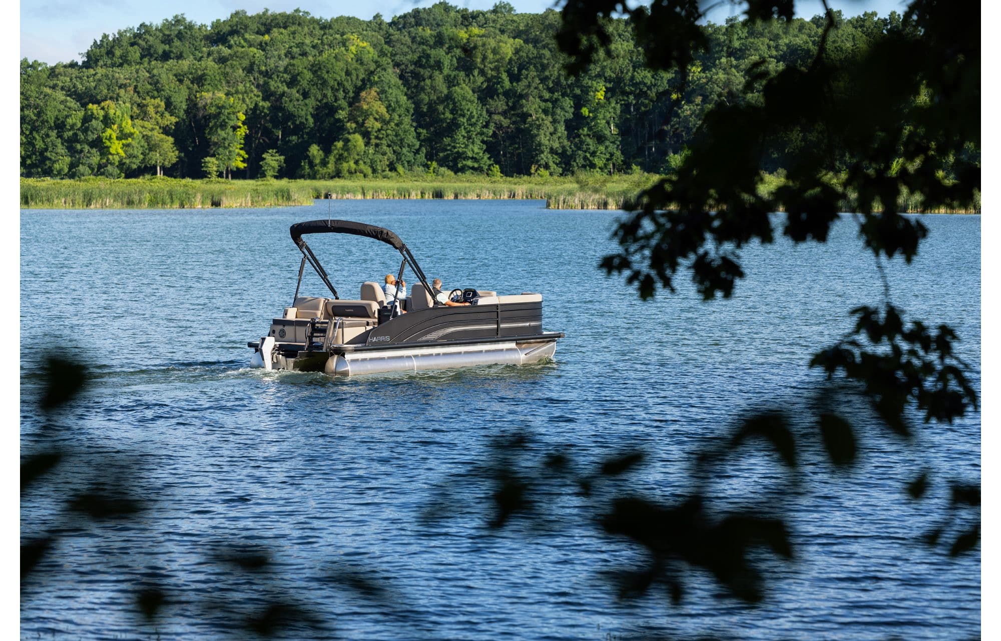 Cruiser e-210 by Harris - Electric pontoon boat on water